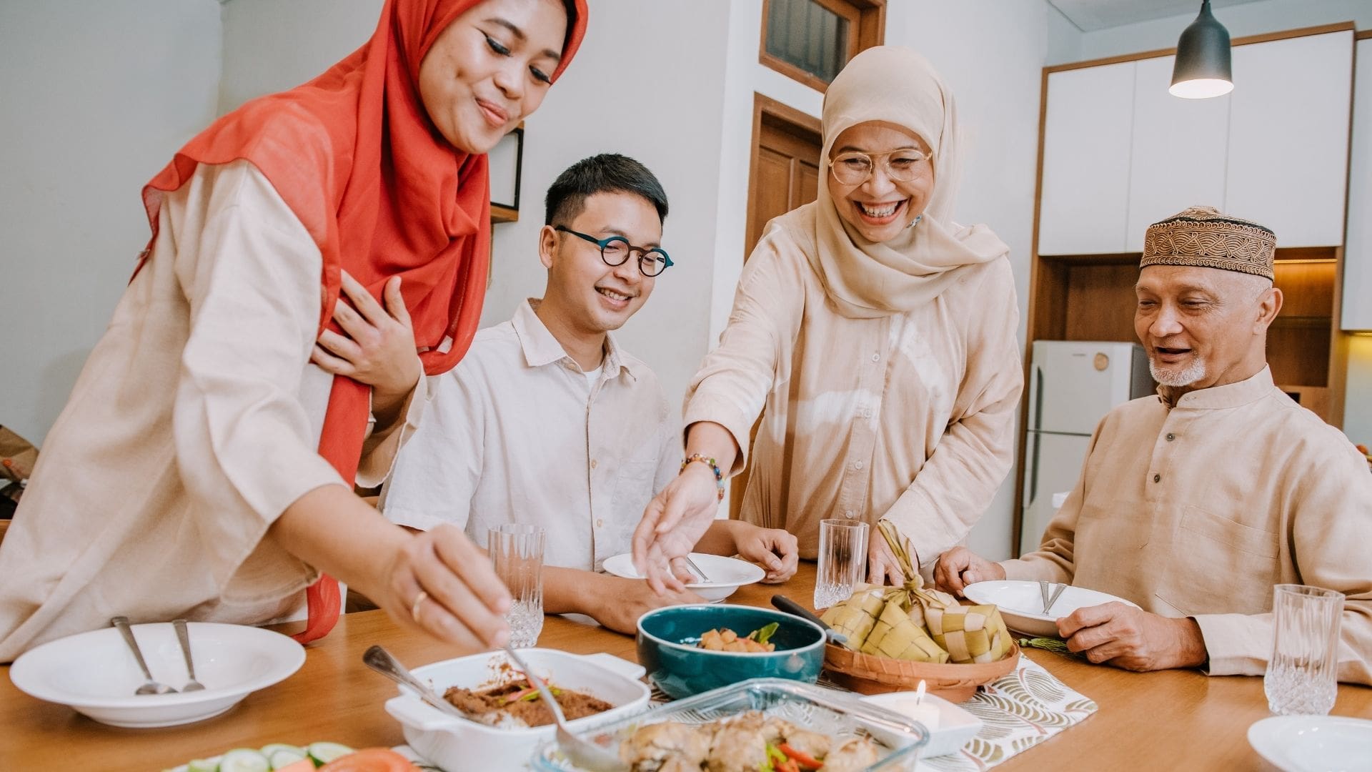 Family gathered around a dining table enjoying a halal-certified dinner, featuring diverse dishes such as grilled meat, fresh vegetables, and rice, symbolizing togetherness and the ethical, hygienic values of halal food. Halal Market 2025